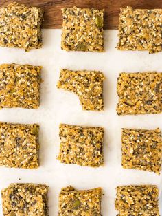 raw and uncooked granola bars lined up on a cutting board