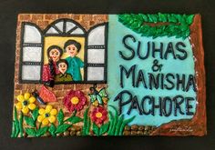 a cake decorated with the words suhas and mansha pachore