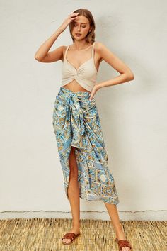 Indulge in your Moroccan dreams with our Sunrise Vacay Skirt! Featuring a stunning print and a flattering ruching effect, this satin skirt will be the center of attention on your next vacation. The full elastic waistband ensures a comfortable fit, while the unique design adds a touch of elegance to your wardrobe. PRE-ORDER 06/14/24 Fabric & fit: 100% rayon Model is wearing size small. Vacation Rayon Midi Skirt, Vacation Midi Rayon Skirt, Rayon Midi Skirt For Vacation, Beach Tiered Skirt With Ruched Details, Summer Vacation Rayon Skirt, Elegant Maxi Skirt With Elastic Waistband For Vacation, Summer Beach Printed Skirt, Chic Beach Rayon Skirt, Summer Rayon Skirt For Vacation