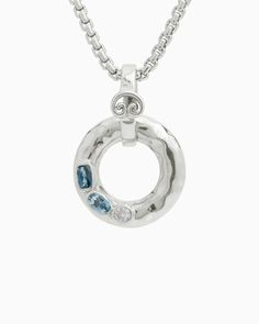 The One Love Pendant, with a gently hammered sterling silver infinite circle, is inspired by the boundless nature of love. This pendant features a faceted rectangle London blue topaz, oval Hampton blue topaz, and circle white zircon stone with a petroglyph detail on the bail. Pair with your favorite chain, sold separately. Metal: Sterling silver Stones: London blue topaz, Hampton blue topaz, white zircon Dimensions: 31.5mm Rectangle Stone Size: 6mm x 4mm Oval Stone Size: 6mm x 4mm Circle Stone S Fusion Style Silver Jewelry With Blue Topaz, White Gold Jewelry With Polished Blue Topaz, Silver Topaz Jewelry With Polished Finish, Timeless Hammered Sterling Silver Jewelry, Modern White Gold Topaz Jewelry, Modern Blue Topaz Jewelry With Accent Stones, Modern Oval Blue Topaz Jewelry, Modern Blue Topaz Jewelry With Gemstone Accents, Hook Bracelet