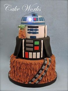 a star wars cake with a robot on top