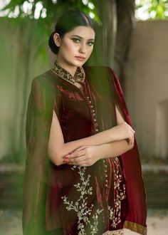 Maroon Velvet cape all handworked with tilla, dabka, and zardozi with jamawar accents. Silk inner shirt matching velvet skinny shalwar with the same work on the bottom Elegant Traditional Wear With Resham Embroidery And Cape Sleeves, Naqshi Raw Silk Traditional Wear For Party, Festive Naqshi Raw Silk Sets, Elegant Anarkali Set With Cape Sleeves For Festivals, Elegant Sherwani With Sheer Dupatta, Designer Velvet Kurta For Diwali, Eid Sets With Dupatta And Cape Sleeves, Bollywood Style Straight Velvet Kurta, Bollywood Style Velvet Party Set