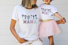 a mother and daughter wearing matching t - shirts that read, i love my mama