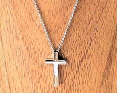 Spiritual Cross Necklace With Silver Chain For Gift, Gift White Gold Cross Necklace In Stainless Steel, Silver Chain Cross Pendant Necklace Gift, Silver Pendant Cross Necklace As Gift, Formal Silver Sterling Silver Cross Necklace, Classic White Gold Cross Necklace As Gift, Classic White Gold Cross Necklace For Gift, Classic White Gold Cross Necklace Gift, Elegant Cross Necklace With Box Chain For Gift