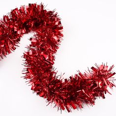 a red tinsel garland on a white background with the letter s in the center