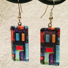 New Without Tag - Never Worn, With Original Gift Box. Artisan Glass Earrings Featuring Contemporary Color Block Design. 1 1/8" Long X 5/8" Wide + Hook, Which Hangs 3/4". Beautiful, Vibrant Colors! From Illness/Smoke/Pet-Free Home. Modern Multicolor Rectangular Jewelry, Handmade Modern Multicolor Earrings, Colorful Earrings As A Gift, Handmade Artistic Rectangular Earrings, Artistic Blue Earrings As Gift, Artistic Handmade Rectangular Earrings, Unique Colorful Earrings For Gifts, Colorful Handmade Modern Earrings, Artsy Colorful Earrings For Gift