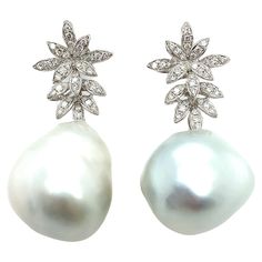 Magnificent pair of one such piece of drop shaped natural pearl and round brilliant diamonds in 18K white gold. The two pearls are slightly differ in shape and the size as the left pearl appears to be slightly longer in length than the right one, as seen in the photograph. However, the pearl was naturally formed and it keep its character. Please note the images may reflect differ colour of the pearls. The colour of the pearls are creamy white, the most sought after colour in pearls, with a brill Cream White Color, Natural Pearl, Pearl Gemstone, Natural Shapes, Brilliant Diamond, Pearl Drop Earrings, Pearl Drop, Natural Pearls, Creamy White