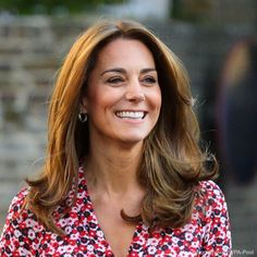 the duke and princess of cambridge smile as they walk together