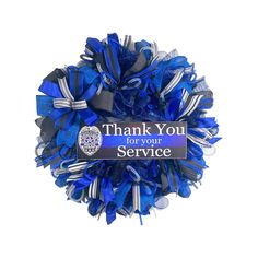 a blue and silver wreath with the words thank you for your service