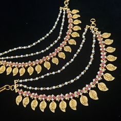 These Chempaswaralu are elegantly designed, from the house of glam to add a hint of ethnic beauty to any look. Representing a classic fusion and exquisite craftsmanship of feminine elegance, this set will definitely be a treasured inclusion in every woman's jewelry collection. The gold finish further enhances a long-lasting shine and sparkling sense. Color, shades, texture displayed may slightly vary from the actual product due to digital image limitations. We request you to consider these minor Gold Bridal Earrings With Latkans For Puja, Gold Chandbalis With Stone Work For Puja, Gold Bridal Earrings With Cutdana For Puja, Gold Tikka With Matching Earrings In Temple Jewelry Style, Gold Chandbalis With Latkans For Puja, Gold Kundan Danglers For Puja, Diwali Gold Plated Dangle Jewelry, Gold Bridal Earrings For Puja And Navratri, Navratri Gold Danglers With Stone Work