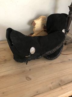 These handmade moccasins will not disappoint. A beautiful black suede, cut high on the ankle and secured with a concho. Unique, stylish, you! The bottom piece of the pictured pair is of a smooth matching leather. Made completely of leather and lined with an additional insole of leather. This configuration is ideal for earthing/grounding. This may be substituted with a synthetic sherpa type pad inside at no cost. Look around the site, our imagination is all that limits us in coming up with what w Handmade Moccasins, Earthing Grounding, Western Culture, Leather Shops, Moccasins, Black Suede, Native American, How To Look Better, Slip On