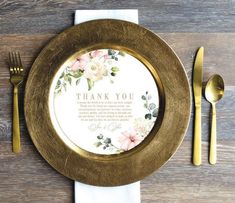 a gold plate with a thank you message on it next to silverware and golden utensils