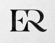 the letter r is made up of black and white paper with some type of lettering on it