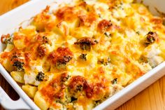 a casserole dish with broccoli and cheese