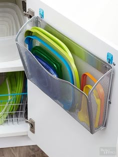 an image of a drawer full of dishes and utensils on the appliance