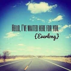 an empty road with the words hello, i've waited here for you everlong