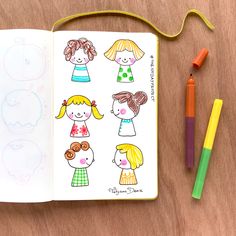 an open notebook with children's drawings on it