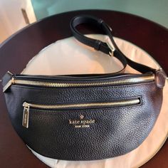 5"H X 13.25"W X 3.25"D Strap Drop: 31" Pebbled Leather Metal Pinmount Logo Two Way Spade Jacquard Lining Interior Credit Card Slots Exterior Dual Front Zip Zip Around Closure Dust Bag Not Included Style No. Wkr00306 Kate Spade Leather Belt Bag, Kate Spade Black Bag With Zipper Closure, Black Kate Spade Bag With Zipper Closure, Casual Kate Spade Leather Bags, Kate Spade New York, Belt Bag, Pebbled Leather, Mini Bag, Card Slots