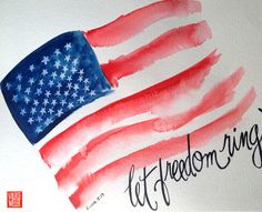 an american flag painted on the side of a white wall with words written below it