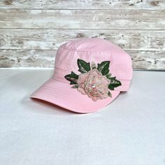 Shabby and Bling Hats will be closed on 2 occasions as I recover from knee surgeries. Closing dates are Sept 1st and Nov 10th. We will be closed about 2 weeks in Sept and 2 weeks beginning Nov. 10th. We ship in 1-3 days!   We ship in 1-3 days!  This blush pink cadet hat is so pretty! It is a soft cotton fabric with a slight pre washed feel to it. It is a military style hat, but very feminine. There is a pretty 4" blush peach flower applique with green leaves on the side of the hat that extends s Pink Flower Mini Hat Adjustable, Pink Adjustable Mini Flower Hat, Pink Baseball Cap With Short Brim, Spring Pink Mini Cap Hat, Adjustable Pink Flat Cap, Pink Adjustable Flat Cap, Pink One Size Fits Most Flat Cap, Bling Hats, Bad Hair Day Hat