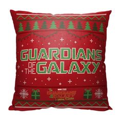 a red pillow with the words guardianss of the galaxy on it and christmas trees