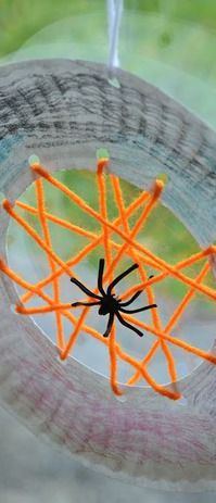 a close up of a paper plate with a spider on it