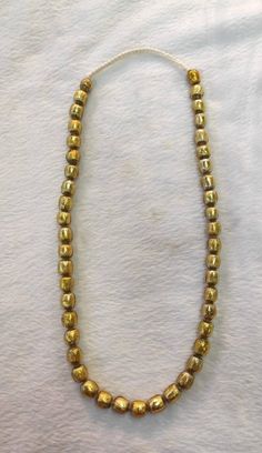 It's Very Beautiful Ancient Unique Color Patina Roman Glass Beads Necklace From 3rd Century Beads NecklaceMaterial Roman GlassHistory 3rd CenturyLength 60cm Gold Single Strand Beaded Necklace With Round Beads, Gold Rondelle Beaded Necklace Single Strand, Gold Necklaces With Polished Metal Beads, Gold Necklaces With Metal Beads, Festive Gold Beaded Necklaces With Spacer Beads, Gold Metal Beads With Large Beads, Gold Metal Beaded Chain Necklace, Gold Beaded Chain Metal Necklaces, Gold Metal Beads Necklace For Jewelry Making