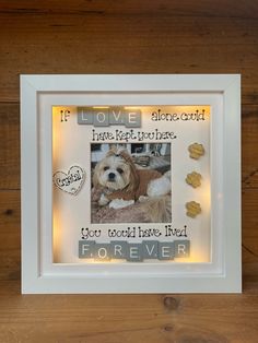 a white frame with a dog on it that says, if love alone comes from the left side