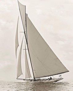 an old photo of a sailboat in the ocean