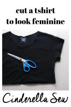 a black shirt with blue scissors on it and the words cut a t shirt to look feminine