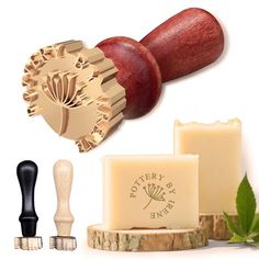 a wooden stamper and some other items on a white background