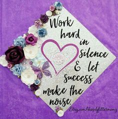 a purple and white graduation cap that says work hard in science and let success make the noise