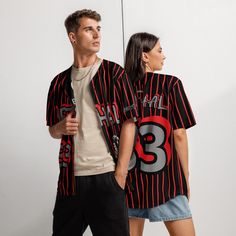 Custom Lethal 33 Baseball Jersey - Scorpion Graphic Streetwear Step up your streetwear game with this bold and eye-catching Lethal 33 Baseball Jersey. Featuring striking red-and-black pinstripes, the standout scorpion graphic, and bold "33" design, this unisex jersey is perfect for those who want to turn heads. ✨ Key Features: Unique Scorpion Graphic: Add an edgy touch to your wardrobe with a detailed metallic scorpion illustration. Customizable Name/Number: Make it yours! Add your name or number for a personalized touch. (Optional) Premium Quality Fabric: Crafted from high-quality breathable fabric for comfort and style. Unisex Fit: Designed for all, this jersey is perfect for both men and women who love bold streetwear fashion. Perfect for Casual Wear or Sports: Whether you're hanging ou Casual Striped Tops For Baseball Season, Casual Striped Tops For Sports Events, Red Varsity Streetwear Top, Red Varsity Top For Streetwear, Black Collegiate Streetwear Tops, Black Varsity Top With Three Stripes, Black Collegiate Style Tops For Streetwear, Red Baseball Collar Top For Streetwear, Fitted Striped Tops For Streetwear