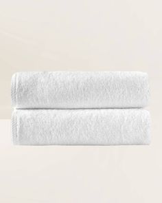 two white towels folded on top of each other