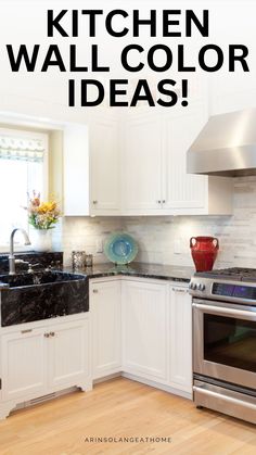 the kitchen wall color is white and has black marble counter tops, an oven with a red vase on it