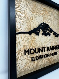 there is a sign on the wall that says mount raney elevation