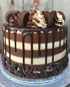 a chocolate cake with white and brown frosting