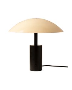 a black table lamp with a white shade on the top and a cord attached to it