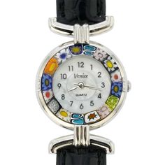 This elegant Murano glass watch is a unique timepiece featuring high-quality workmanship and the most famous Murano technique- Millefiori (a thousand flowers)- which has become a trademark of Murano glass making. Stylized flowers in beautiful colors grace the hand-made face of this watch and give it a trendy and unmistakably Venetian look. This Murano watch adds a perfect accent to any wardrobe and works equally well for your casual outing or a night on the town. The face of this Murano glass wa Luxury Multicolor Watches For Gifts, Luxury Multicolor Watches For Gift, Luxury Multicolor Watches As Gift, Multicolor Analog Watches For Gift, Multicolor Analog Watches As Gift, Gift Multicolor Analog Watches, Elegant Multicolor Round Dial Watches, Multicolor Round Watches For Gift, Multicolor Round Watches As Gifts