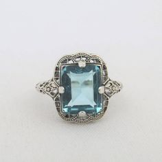 an antique style blue topazte and diamond ring