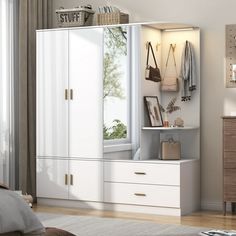 a bedroom with a bed, dresser and closet in the corner next to a window