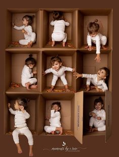 a group of babies in boxes playing with each other