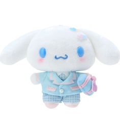 a white stuffed animal with blue eyes