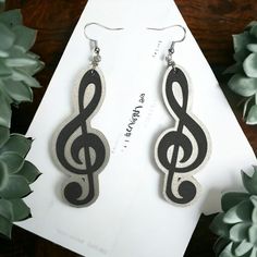 Add a touch of musical flair to your ensemble with our charming music note earring set, crafted from a combination of sleek acrylic and supple faux leather. Each earring showcases the iconic symbol of a music note, capturing the essence of your passion for music in a stylish accessory. Whether you're attending a concert or simply expressing your love for melody, these earrings are the perfect addition to your collection. Flaunt your unique style with these lightweight and versatile earrings that effortlessly blend modern design with musical inspiration. Music Note Earrings, Music Accessories, New Braunfels, Music Note, Music Notes, Stylish Accessories, Earring Set, Jewelry Earrings Dangle, Laser Cut