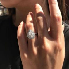 a close up of a person wearing a ring