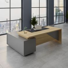 an office desk in front of large windows overlooking the city