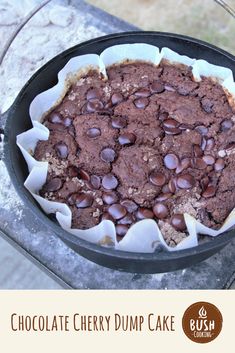 chocolate cherry dump cake in a cast iron skillet on an outdoor table with text overlay