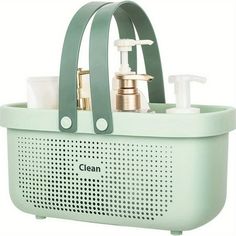 a green basket with soap and lotion in it