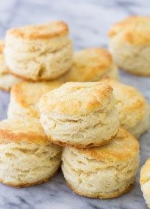 some biscuits are stacked on top of each other and ready to be eaten for breakfast