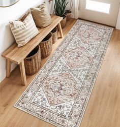 a large area rug is on the floor next to a wooden bench and potted plant